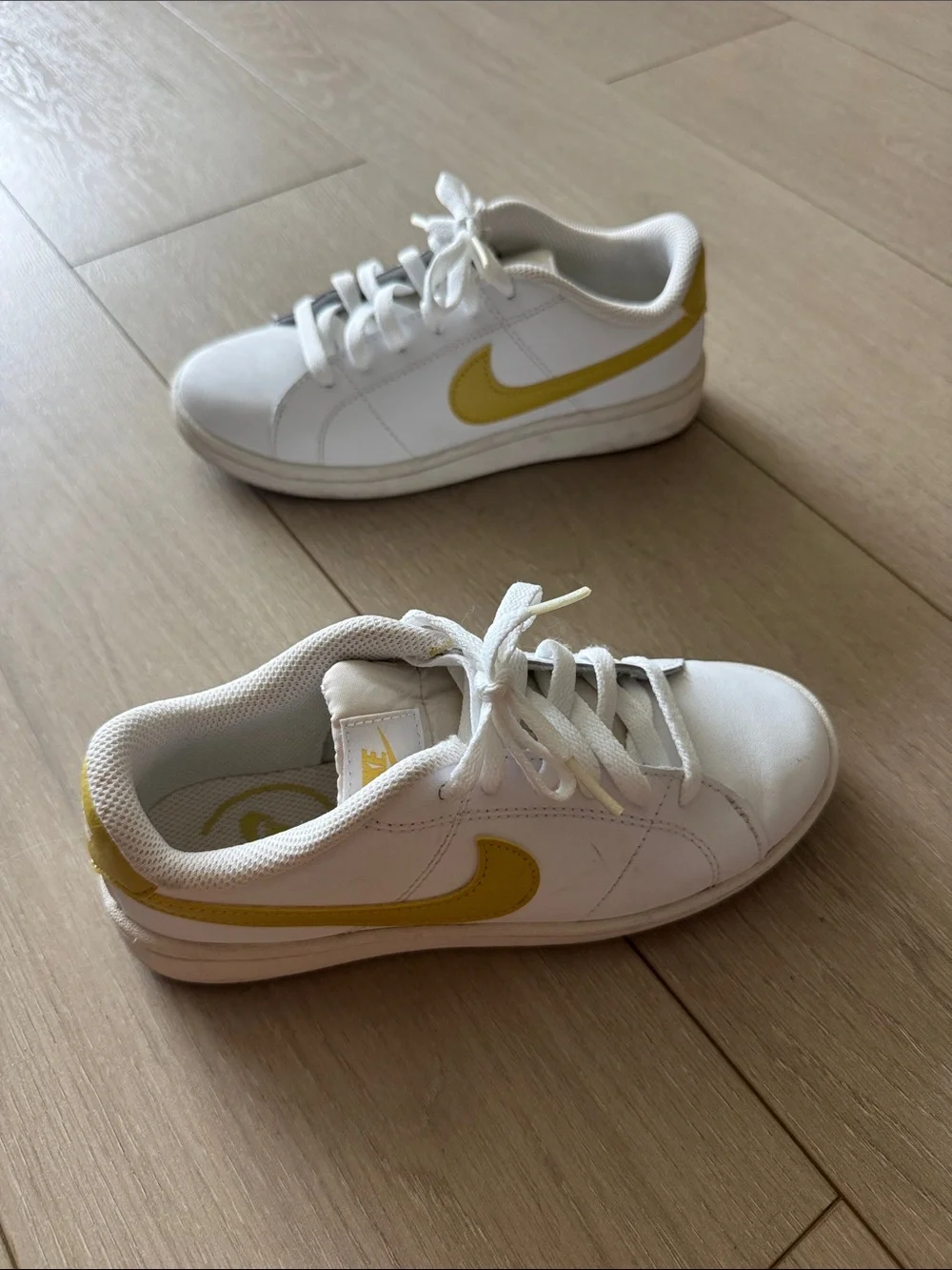 Nike White Sneakers with Yellow Swoosh